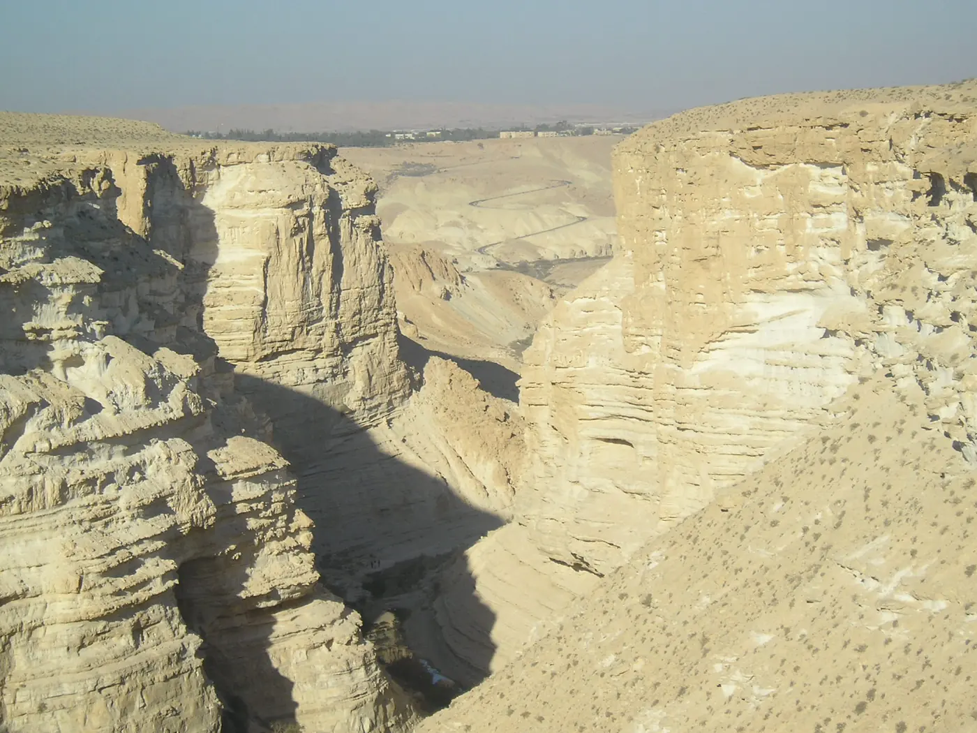 Layered rock cliffs of the Ramon Crater in the Negev desert